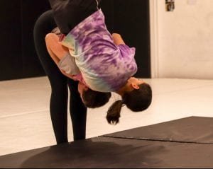 women being thrown on mat women classes