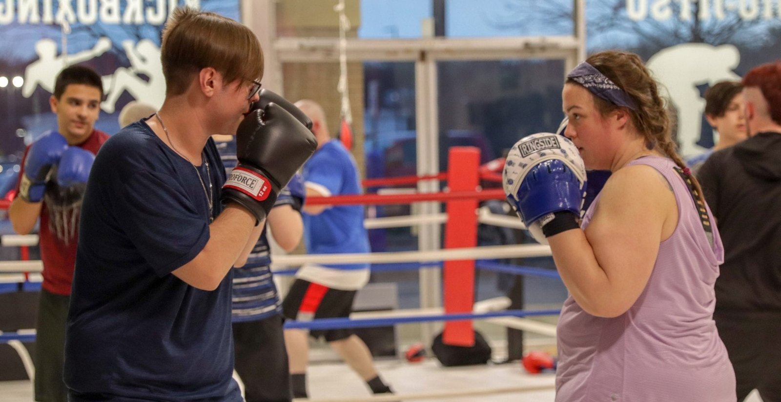 two young adults sparring