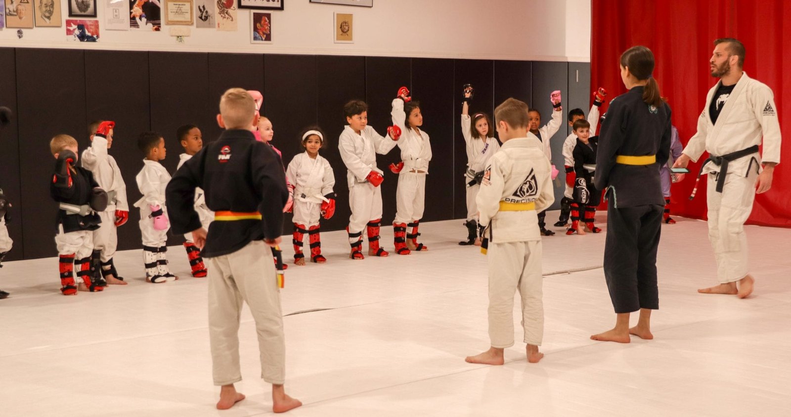 kids lined up and participating in bjj class
